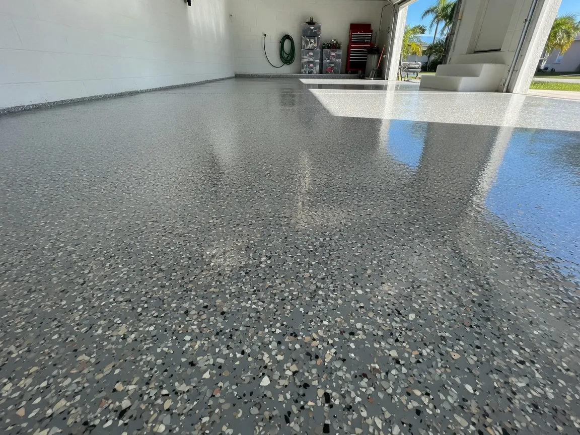Full-broadcast multi-color epoxy flake garage floor with glossy protective topcoat